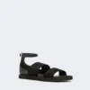 Flat sandals in leather and elasticated webbing, black