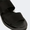 Flat sandals in leather and elasticated webbing, black