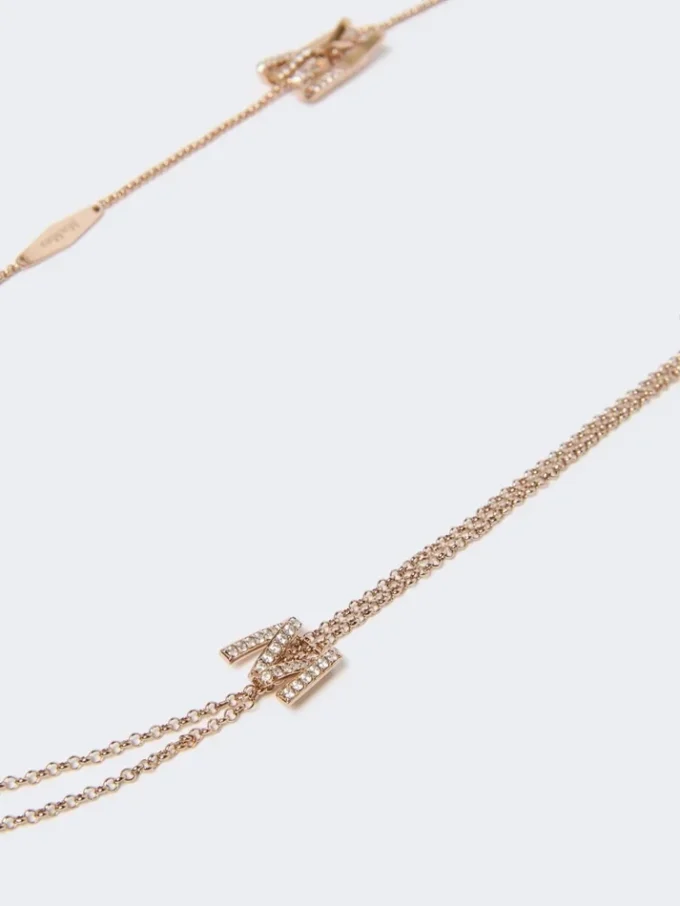 Long necklace with monogram details, ivory