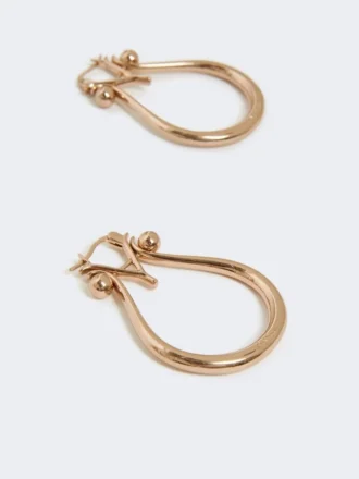 Monogram earrings in metal, gold