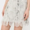 Short skirt with petals in printed organza, pearl grey