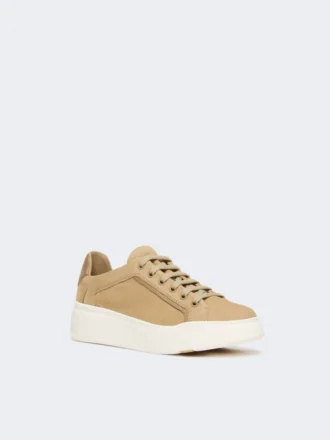 Suede sneakers, sand